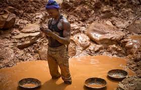 A man collecting gold